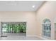 Large living room featuring plenty of natural light and a view of the outdoor living area at 4472 Calle Serena, Sarasota, FL 34238
