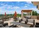Charming outdoor patio with a mix of lounge seating and dining sets, perfect for enjoying the golf course views at 4472 Calle Serena, Sarasota, FL 34238