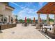 Inviting outdoor patio with comfortable seating, golf course views, and shade from the bright sun at 4472 Calle Serena, Sarasota, FL 34238