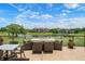 Relax on the outdoor patio with lovely lake and golf course views at 4472 Calle Serena, Sarasota, FL 34238