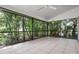 Screened patio surrounded by lush landscaping, trees and greenery at 4472 Calle Serena, Sarasota, FL 34238