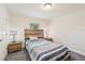 Bedroom with wooden headboard, carpet, and matching nightstands with stylish lamps at 4610 Clarke St, North Port, FL 34286