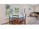 Cozy breakfast nook bathed in sunlight, featuring a charming table and chairs with views of the outdoors at 4610 Clarke St, North Port, FL 34286