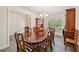 Traditional dining room featuring a wood table, stylish chairs and a classic china cabinet at 4610 Clarke St, North Port, FL 34286