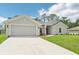This home features a well-maintained lawn, two-car garage, and a cozy, inviting entrance at 4610 Clarke St, North Port, FL 34286