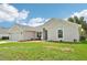 This single-story home boasts a well-manicured lawn, convenient two-car garage, and tidy landscaping at 4610 Clarke St, North Port, FL 34286