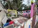 Charming backyard retreat with unique decorations, stone pavers, and a tranquil fountain at 5011 Elfrida Ave, Sarasota, FL 34235