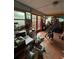 Art studio with plenty of light, colorful accents, and a door to the exterior at 5011 Elfrida Ave, Sarasota, FL 34235