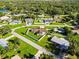 Neighborhood aerial view showcasing lush greenery and well-manicured lawns at 5200 Malaga Ave, Sarasota, FL 34235