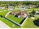 Beautifully fenced home featuring a well-maintained lawn and charming landscaping at 5200 Malaga Ave, Sarasota, FL 34235