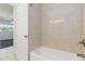 Tiled bathroom with a shower and tub combination at 5200 Malaga Ave, Sarasota, FL 34235