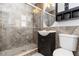 Modern bathroom features a glass shower, sleek vanity and toilet at 5200 Malaga Ave, Sarasota, FL 34235