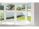 Bay window offers a bright spot to relax and enjoy backyard views of lawn and fence at 5200 Malaga Ave, Sarasota, FL 34235