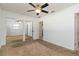 Bedroom with mirrored closet doors and ceiling fan at 5200 Malaga Ave, Sarasota, FL 34235