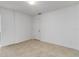 Bright bedroom with neutral walls and tile flooring offers a serene and inviting space at 5200 Malaga Ave, Sarasota, FL 34235