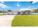 Charming single-story home with a well-maintained lawn, concrete driveway, and two-car garage at 5200 Malaga Ave, Sarasota, FL 34235