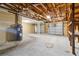 Large garage with rolling doors, water heater and exposed ceiling at 5200 Malaga Ave, Sarasota, FL 34235