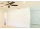 Bright living room with tile flooring, ceiling fan and white walls for a modern look at 5200 Malaga Ave, Sarasota, FL 34235