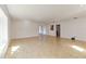 Bright, open living room with tile floors and sliding glass doors leading to an outdoor area at 5200 Malaga Ave, Sarasota, FL 34235
