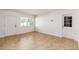 Bright living room featuring tile floors, two doors, and a window at 5200 Malaga Ave, Sarasota, FL 34235
