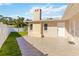 Back patio with tiled surface and brick chimney offering comfortable outdoor living at 5200 Malaga Ave, Sarasota, FL 34235