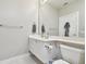 Bright bathroom features a white vanity, a large mirror, and ample counter space at 5368 Eliseo St, Sarasota, FL 34238