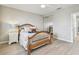 Bedroom featuring mirrored closet, wood look floors, wooden bed frame, and ceiling fan at 5368 Eliseo St, Sarasota, FL 34238