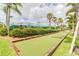 Bocce ball court, framed by lush greenery, offering a serene outdoor recreational space at 5368 Eliseo St, Sarasota, FL 34238