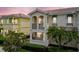 Beautiful two-story home featuring balconies, arched windows, and lush landscaping at 5368 Eliseo St, Sarasota, FL 34238