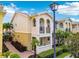 Charming two-story home with a balcony, manicured landscaping and a brick walkway at 5368 Eliseo St, Sarasota, FL 34238