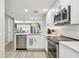 Stylish kitchen with stainless steel appliances, granite countertops, and seamless views to the outdoor patio at 5368 Eliseo St, Sarasota, FL 34238