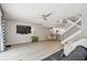 Spacious living area featuring tile floors and white staircase at 5368 Eliseo St, Sarasota, FL 34238
