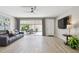 Bright living room with tile floors, comfortable seating, and view of outdoor patio at 5368 Eliseo St, Sarasota, FL 34238