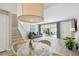 Open living space with a living room, dining area, and stairs featuring light-colored wood floors at 5368 Eliseo St, Sarasota, FL 34238