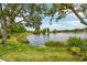 Scenic pond with a fountain and lush greenery creates a peaceful atmosphere at 5368 Eliseo St, Sarasota, FL 34238
