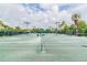Well-maintained tennis court with a covered seating area, perfect for enjoying a game in a beautiful community at 5368 Eliseo St, Sarasota, FL 34238