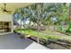 A screened-in porch offers views of the expansive backyard at 5508 83Rd E Ter, Sarasota, FL 34243