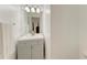 Well-lit bathroom features a white vanity with brushed silver hardware and a large mirror at 5508 83Rd E Ter, Sarasota, FL 34243