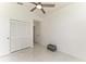 Bedroom with white marble floors, vaulted ceiling, closet and basket for storage at 5508 83Rd E Ter, Sarasota, FL 34243