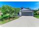 Charming single-story home with a well-manicured lawn and a two-car garage at 5508 83Rd E Ter, Sarasota, FL 34243
