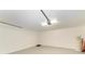 Clean garage space features modern door hardware and plenty of room for parking at 5508 83Rd E Ter, Sarasota, FL 34243