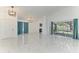 Spacious living room with stylish lighting and sliding glass doors at 5508 83Rd E Ter, Sarasota, FL 34243