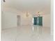 Open concept living room with vaulted ceilings and large format tile at 5508 83Rd E Ter, Sarasota, FL 34243