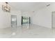 Bright living room featuring vaulted ceilings and large glass sliding doors at 5508 83Rd E Ter, Sarasota, FL 34243