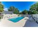 Community pool with lounge chairs, umbrellas, and well-kept surrounding area offers a relaxing atmosphere at 5508 83Rd E Ter, Sarasota, FL 34243