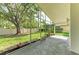 View of the Screened-In Porch featuring a well manicured backyard at 5508 83Rd E Ter, Sarasota, FL 34243
