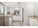 Spa-like bathroom with soaking tub, glass-enclosed shower, and granite vanity at 5644 Flagstone Trl, Palmetto, FL 34221