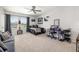 Inviting bedroom with neutral colors and a comfortable seating area, plus a ceiling fan at 5644 Flagstone Trl, Palmetto, FL 34221
