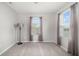 Sunlit bedroom with large windows and neutral walls, ready for personalization at 5644 Flagstone Trl, Palmetto, FL 34221
