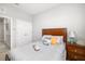 Comfortable bedroom showcasing a queen-size bed, side table, and ample closet space at 5644 Flagstone Trl, Palmetto, FL 34221